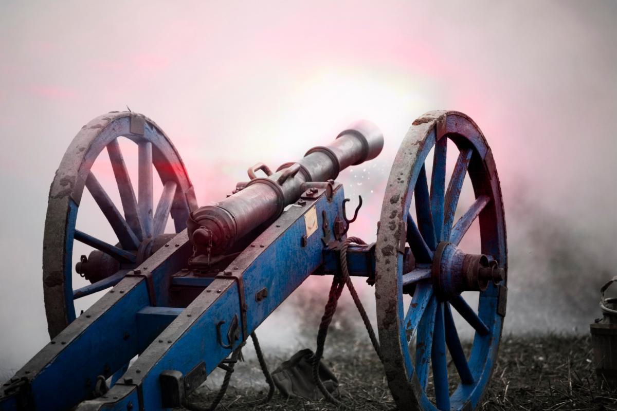 Revolutionary era cannon being fired