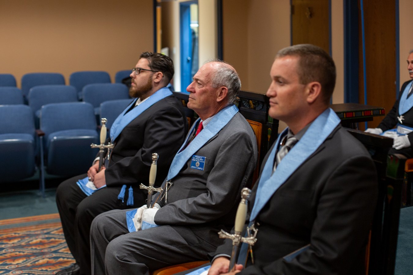 Masons in regalia sitting together