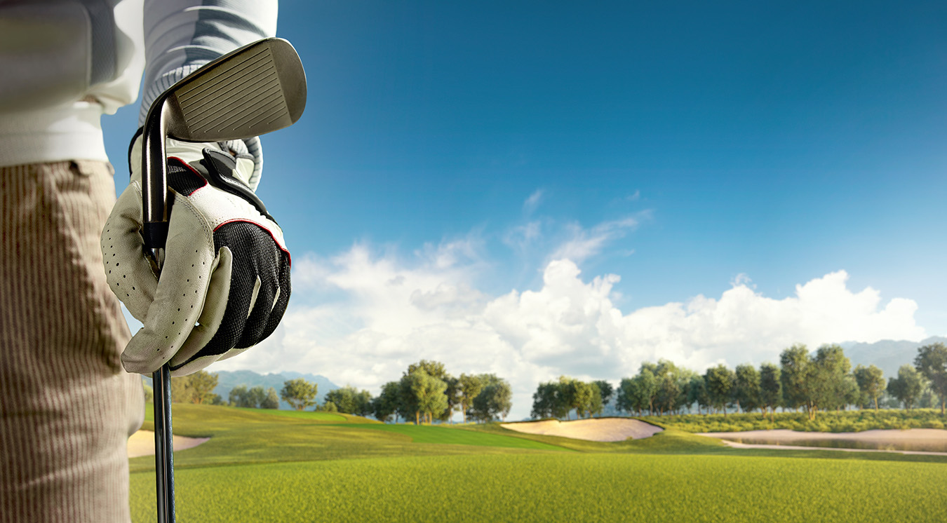 Closeup of golfer's hand with club