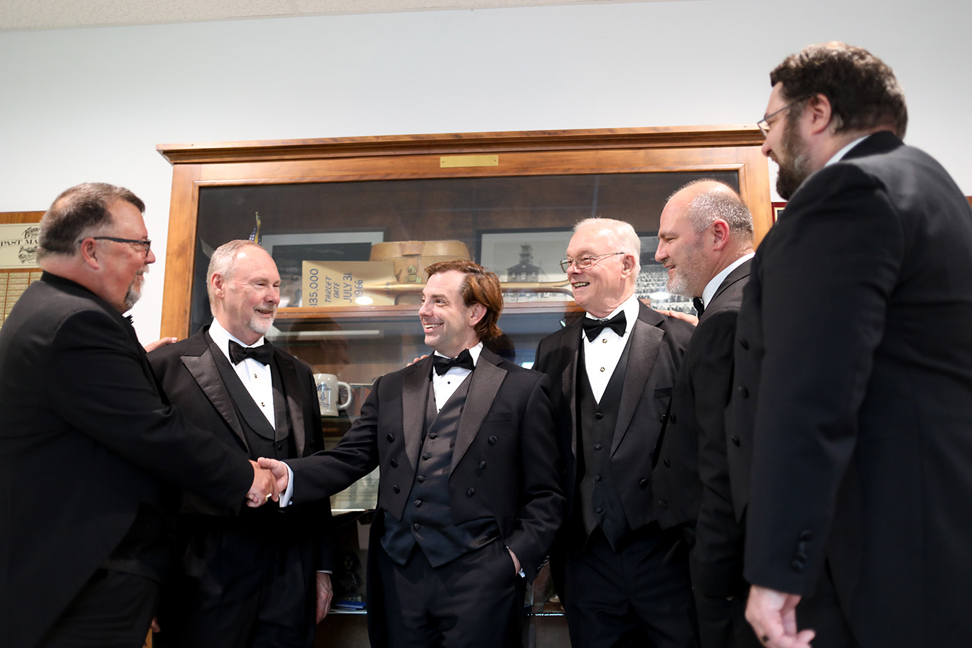 Group of Freemasons meeting, shaking hands