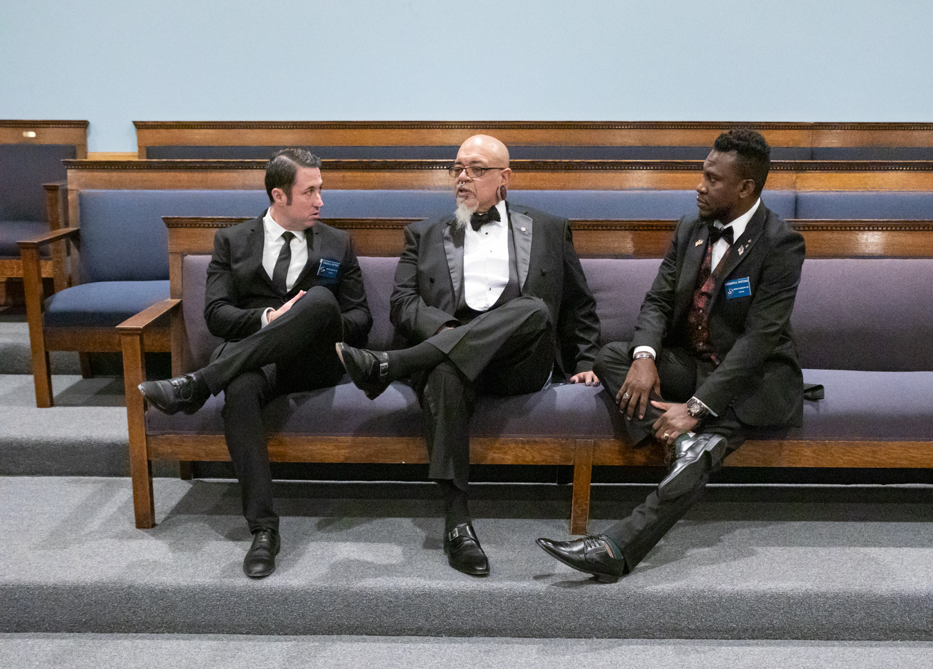 Three Masons sitting in lodge.